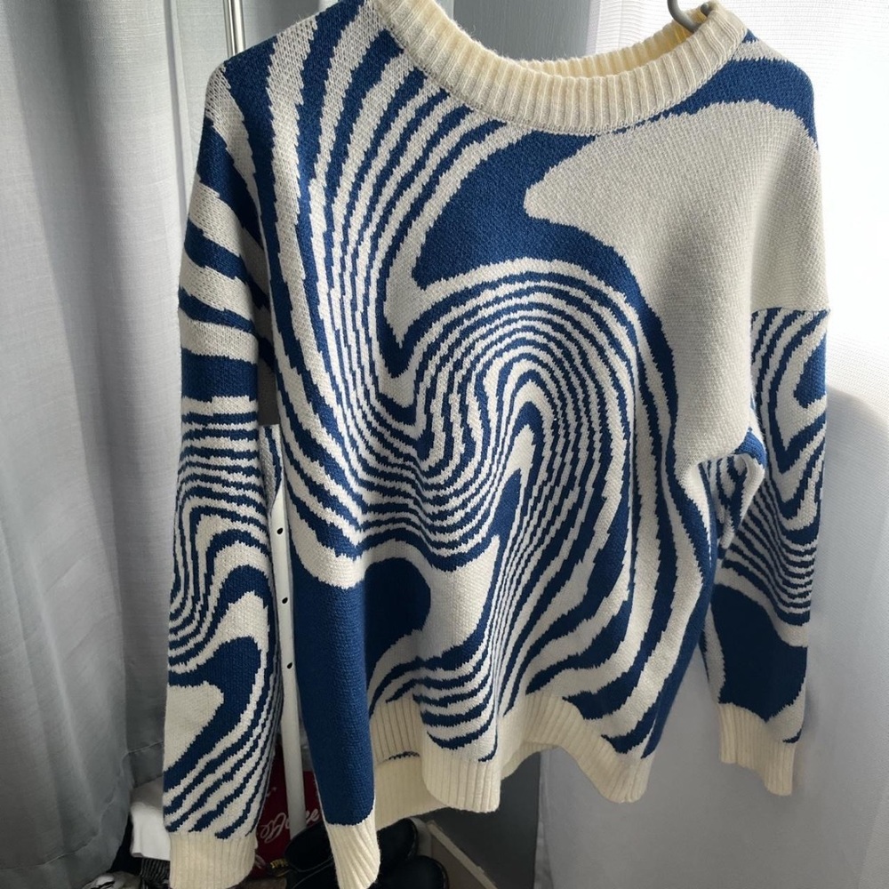 blue and white swirl pattern sweater